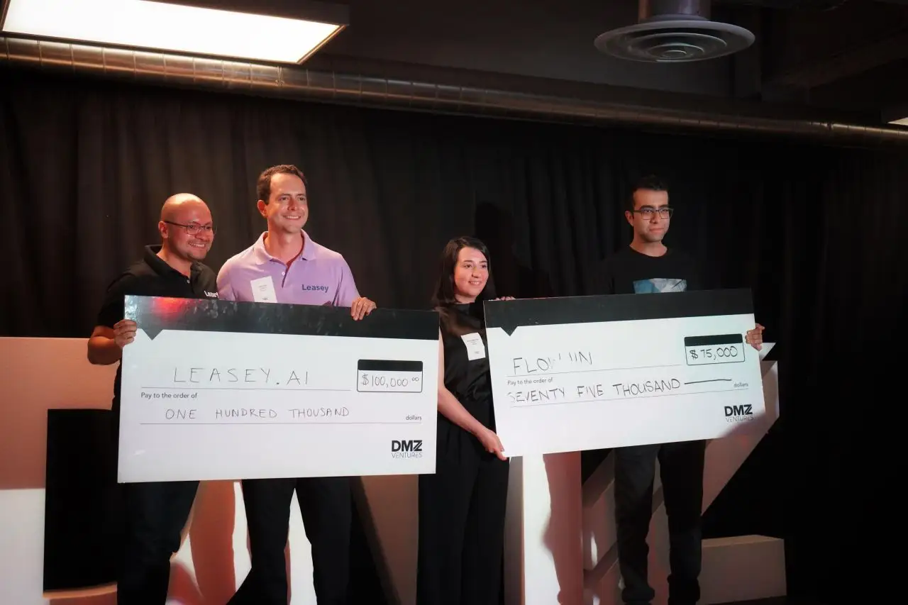 Photo of DMZ Insiders awarding $250,000 CAD to pitch competition winners.