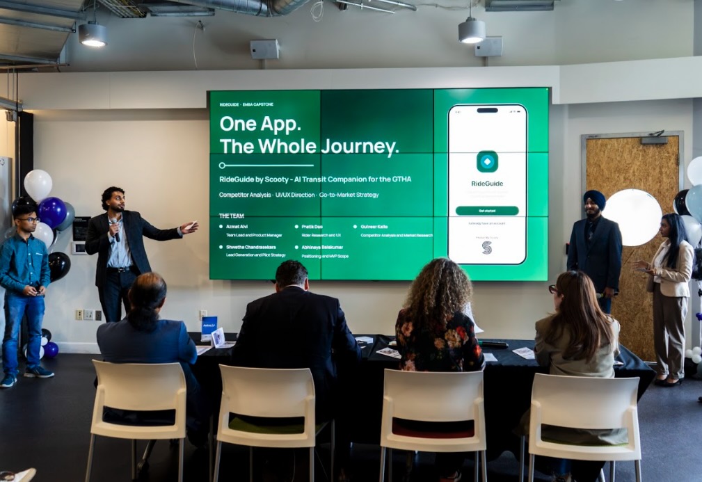 Team Scooty pitches at the Embark Em-BA Demo Day