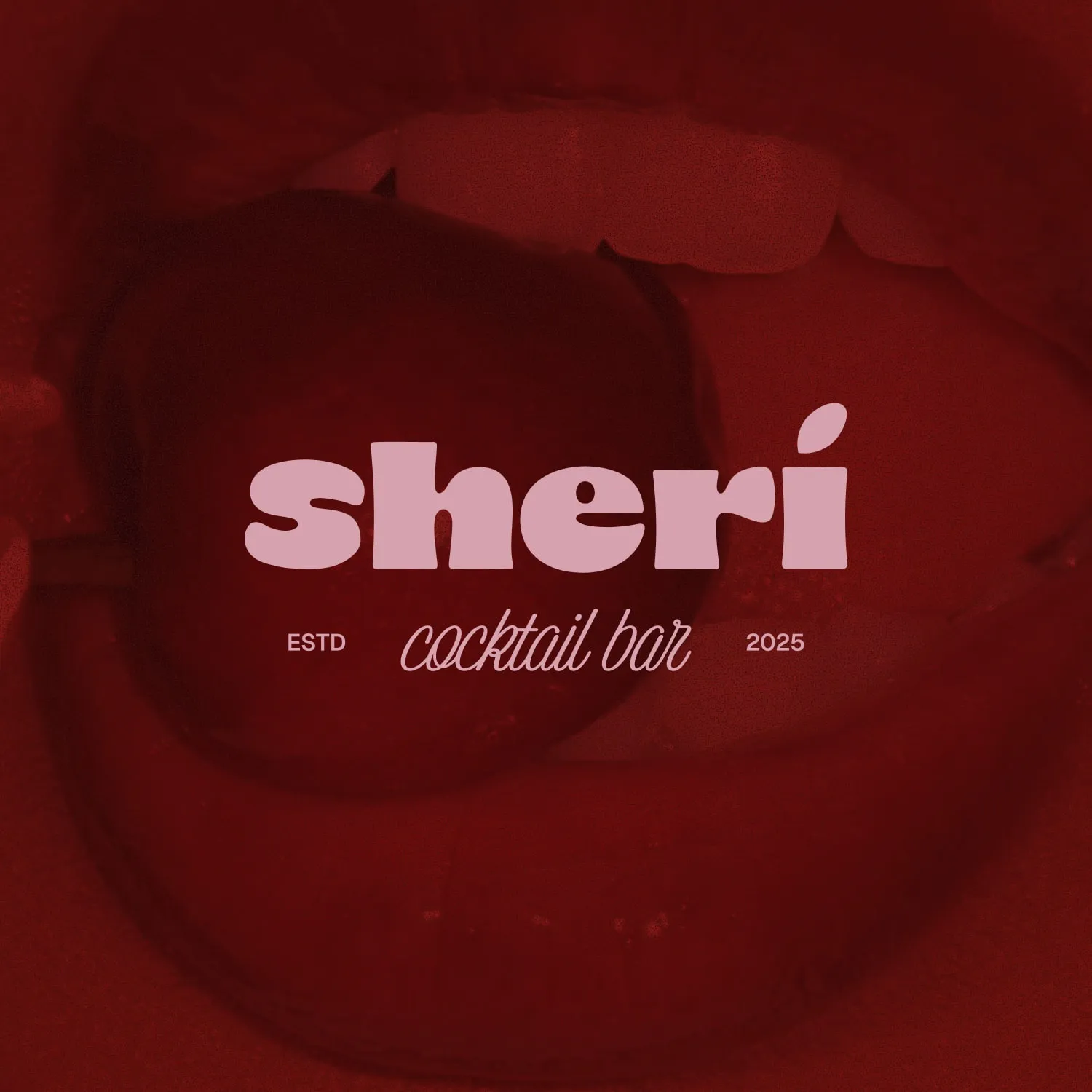 light logo featuring name sheri on dark red background