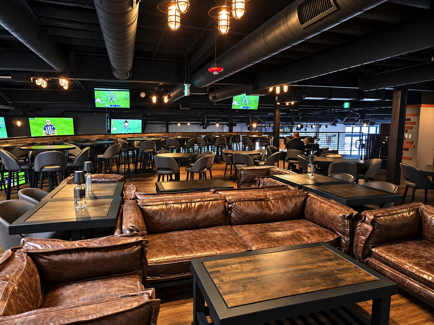 Bar seating and big-screen TVs at Hendo's Barrel House sports bar in Temecula