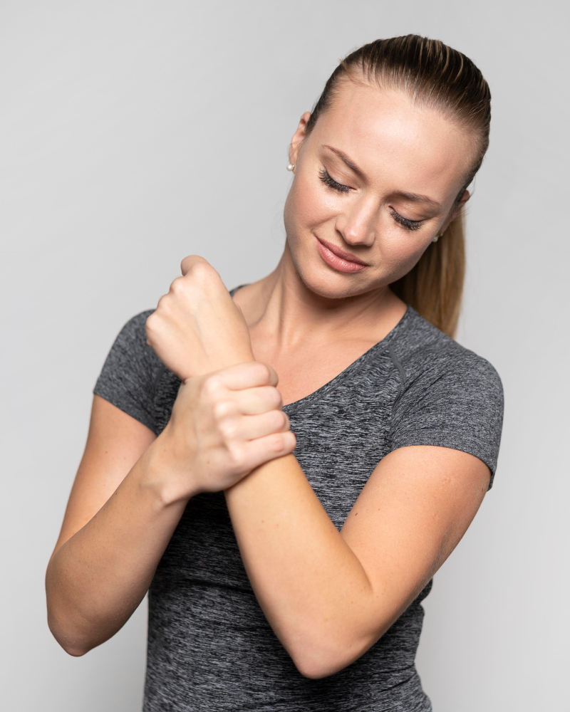 Physical therapist performing hands-on wrist assessment and manual therapy treatment at Norton Physical Therapy in Washington DC