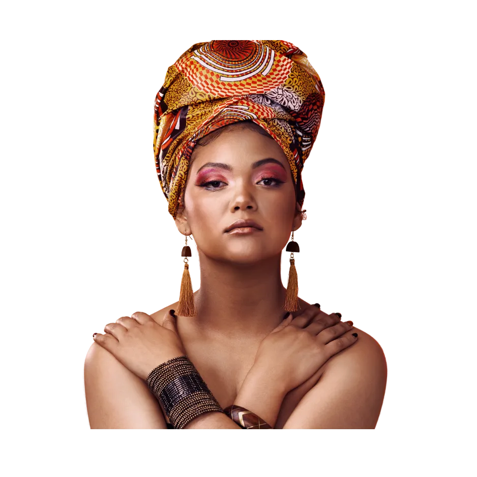 Woman in vibrant African-print headwrap with bold makeup and tassel earrings