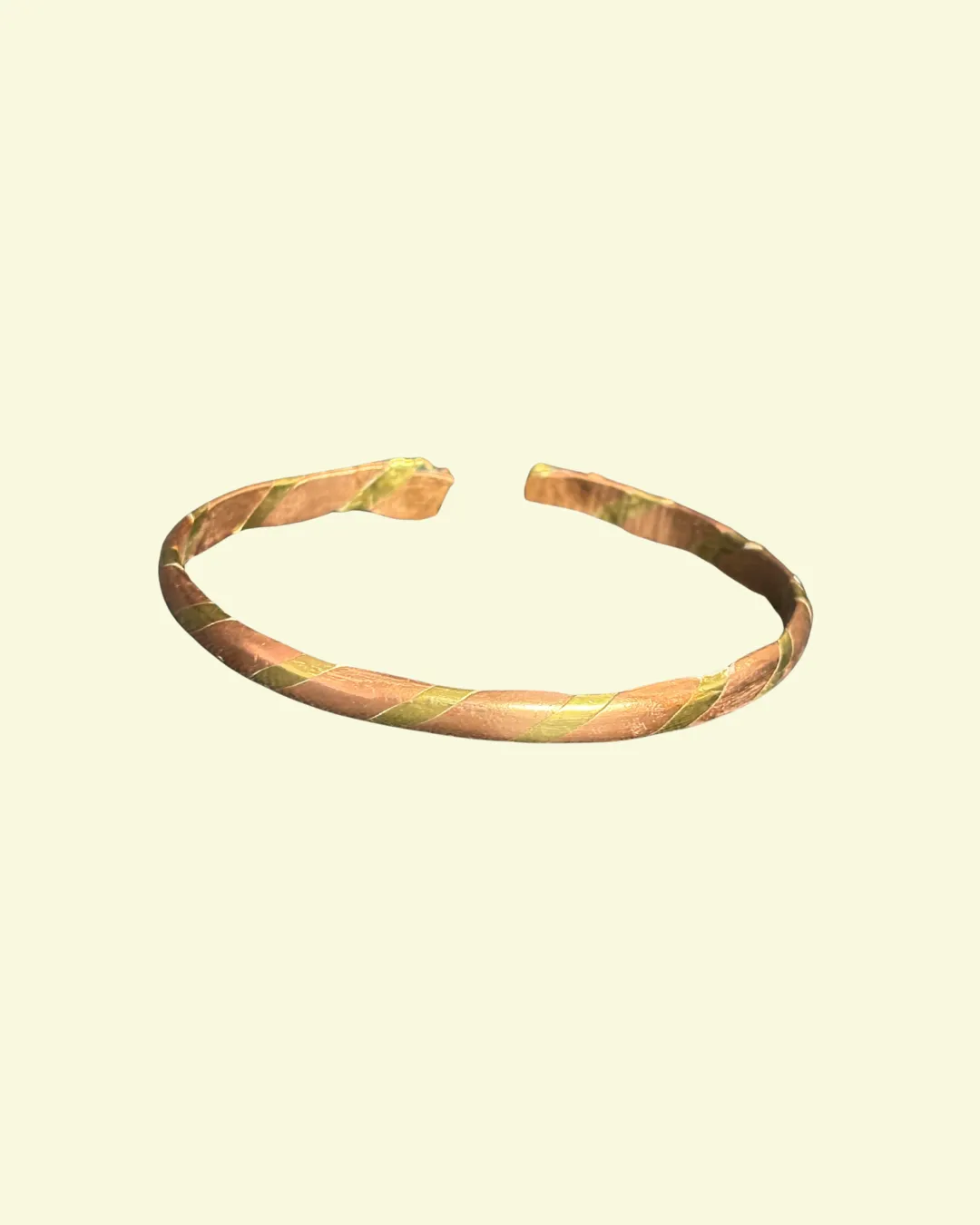 Twisted metal bracelet with copper and green metallic colors