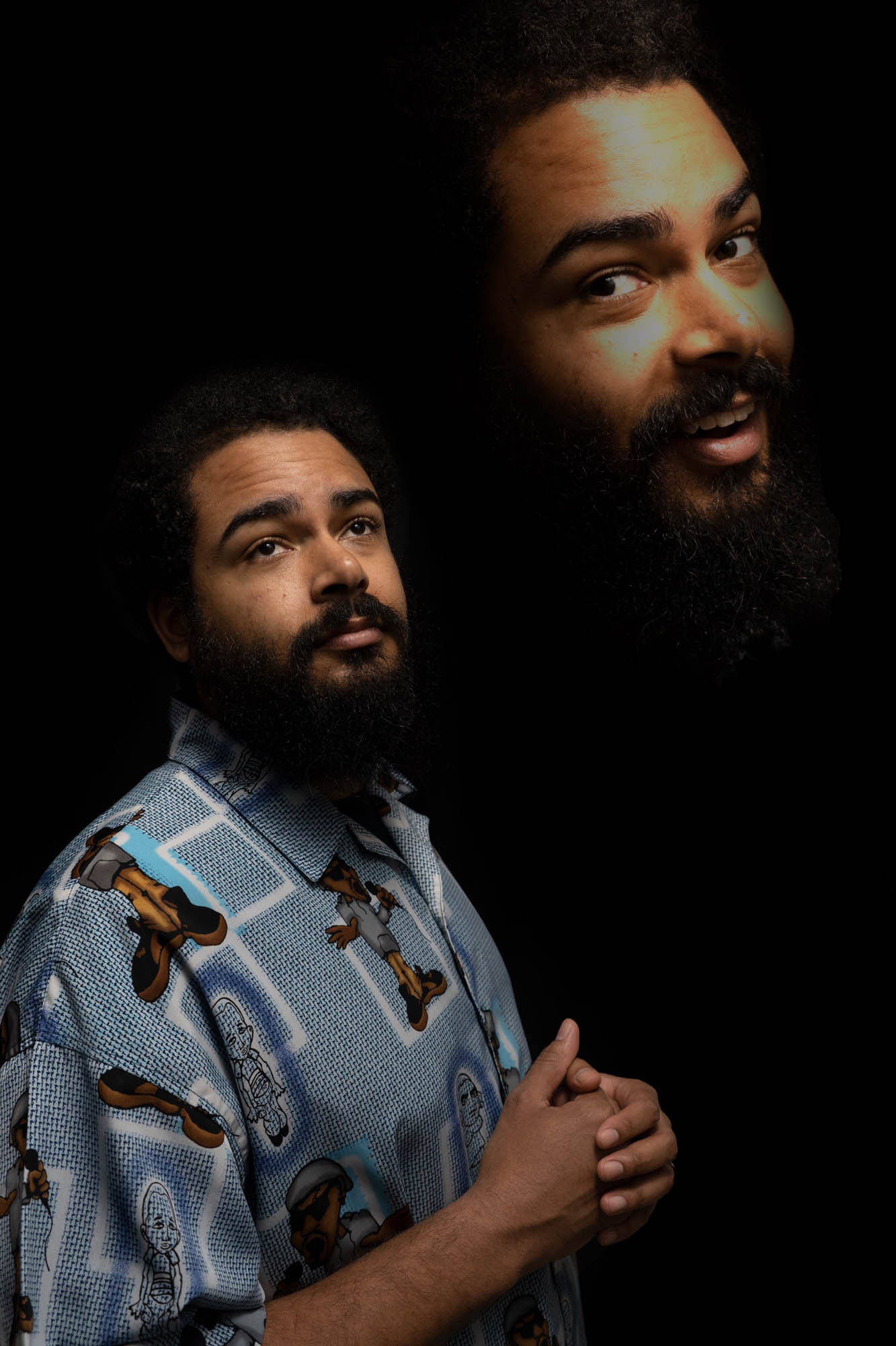 An image of comedian Curtis Cook wearing a blue patterned shirt, shown in a portrait with a larger smiling version of his own face above. Photography by Lex Voight