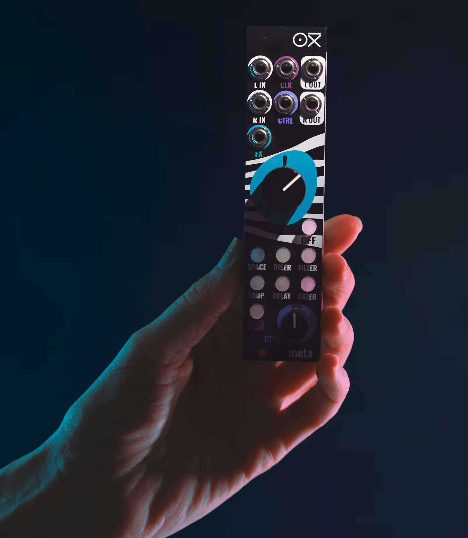 OXI Meta Eurorack FX module held in a hand