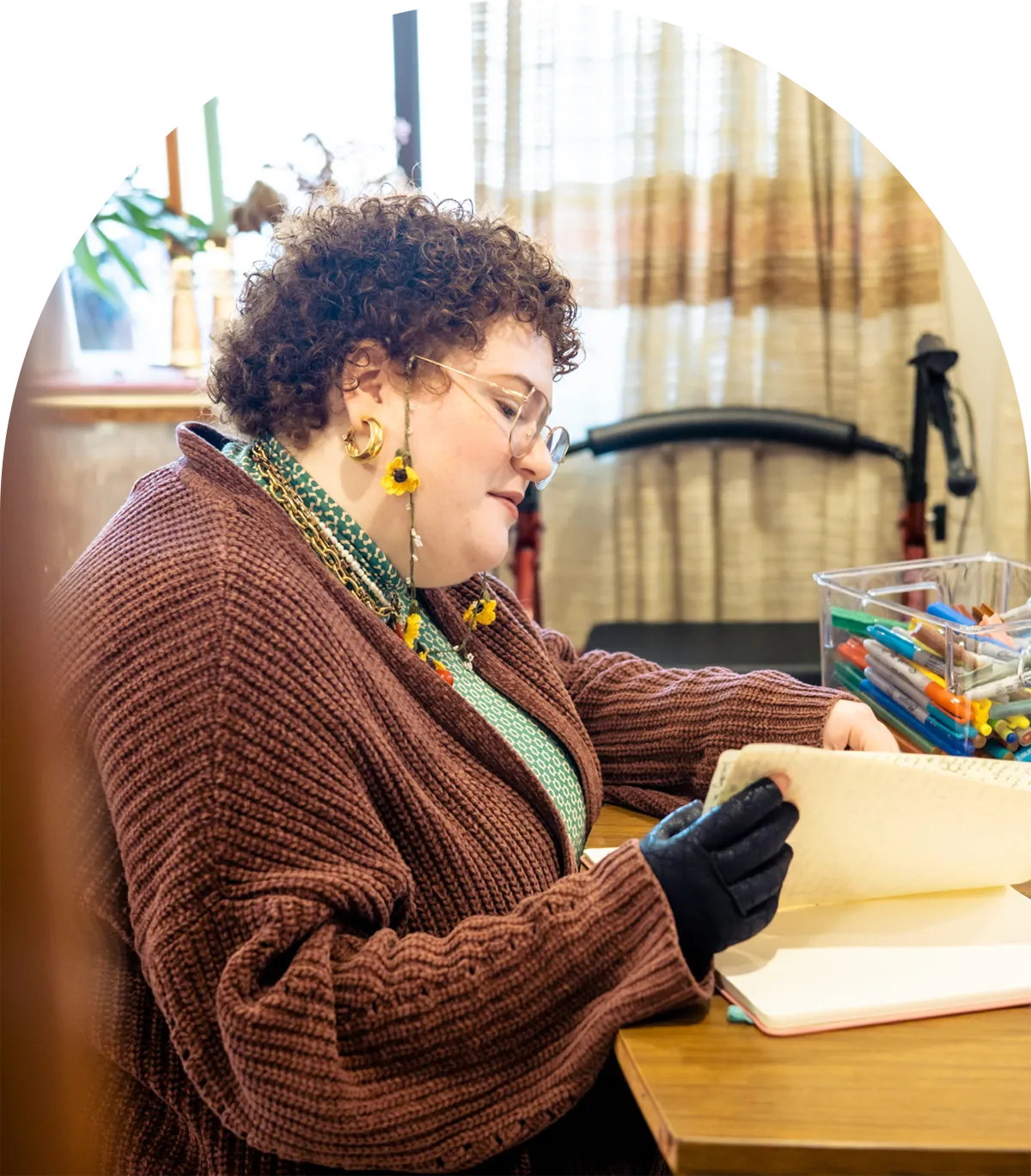 A photo of Emilia sitting at their desk