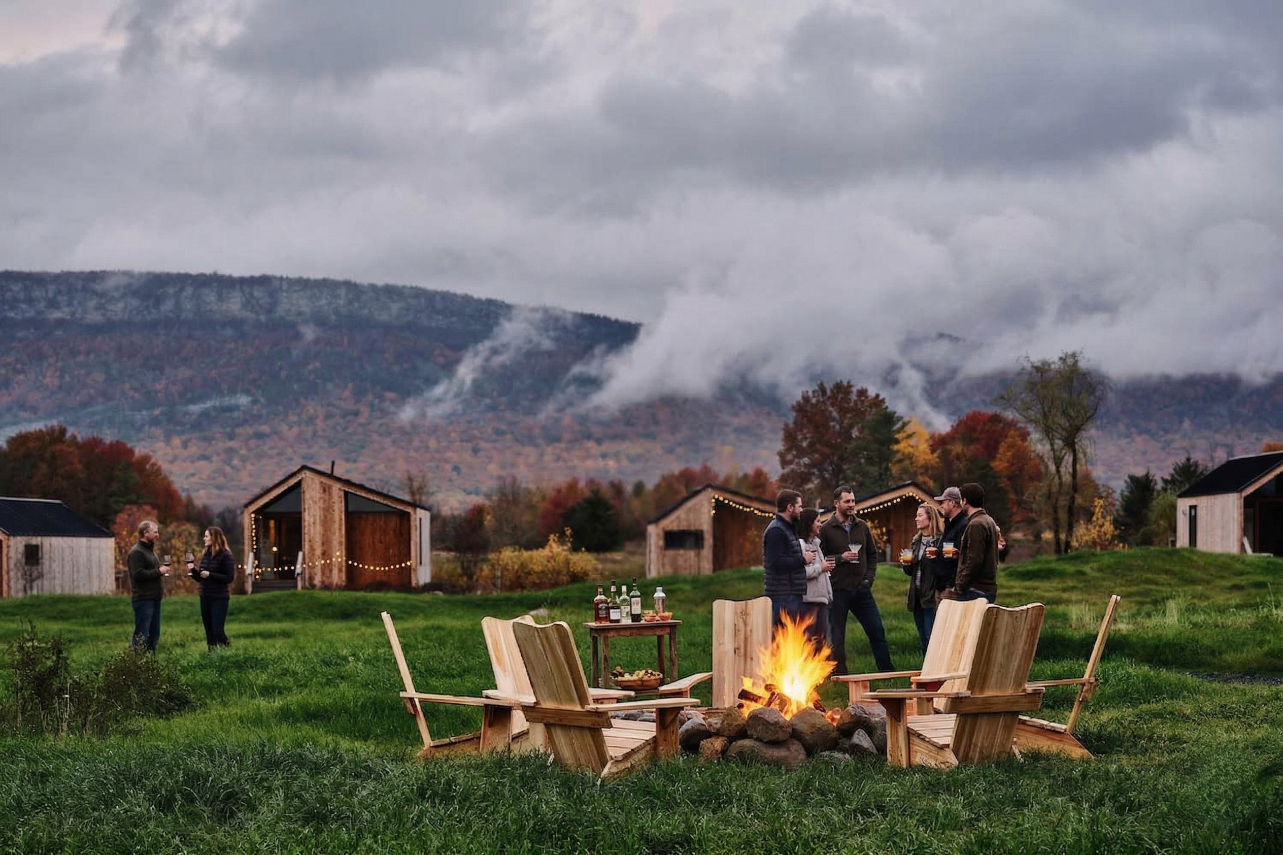 Team gathered around a campfire at a company retreat