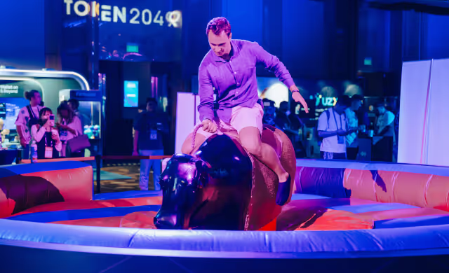 a man riding a mechanical bull