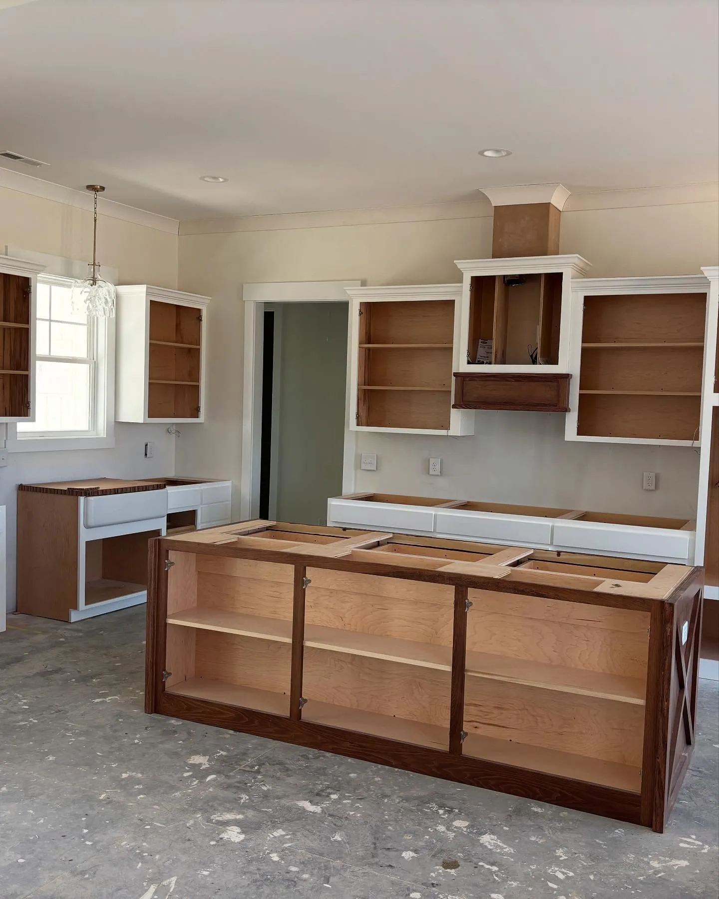 New kitchen cabinets installed during a custom home construction by Lee Brothers Construction in Greenville, NC.