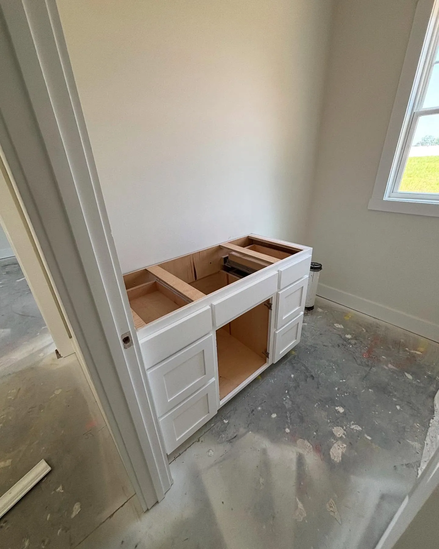 New cabinet installed in guest bathroom during a residential renovation by Lee Brothers Construction in Greenville, NC.