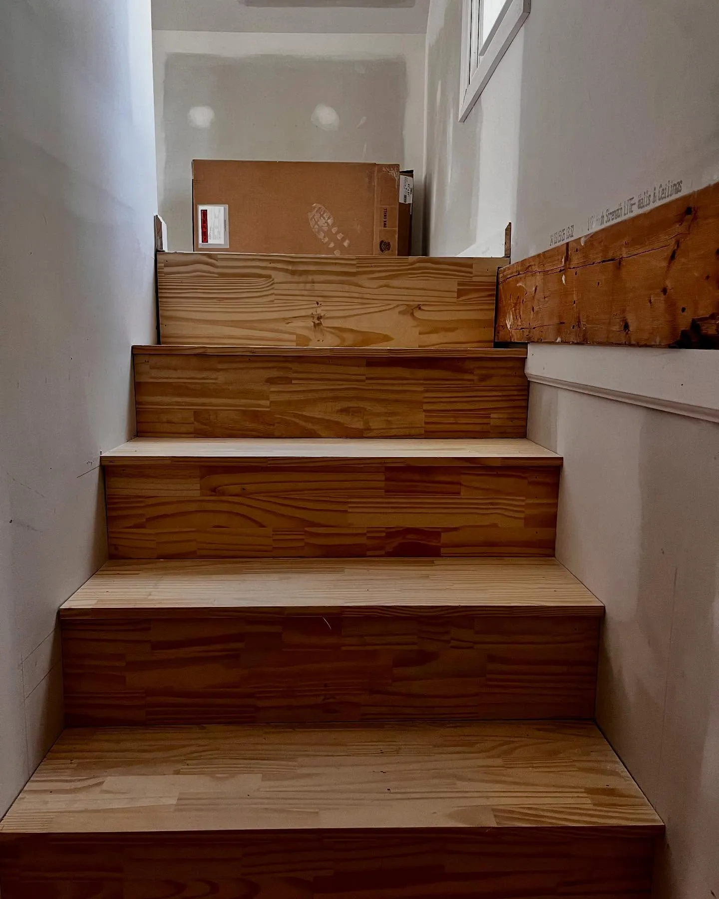 Staircase installation in a new home construction project by Lee Brothers Construction in Ayden, NC.