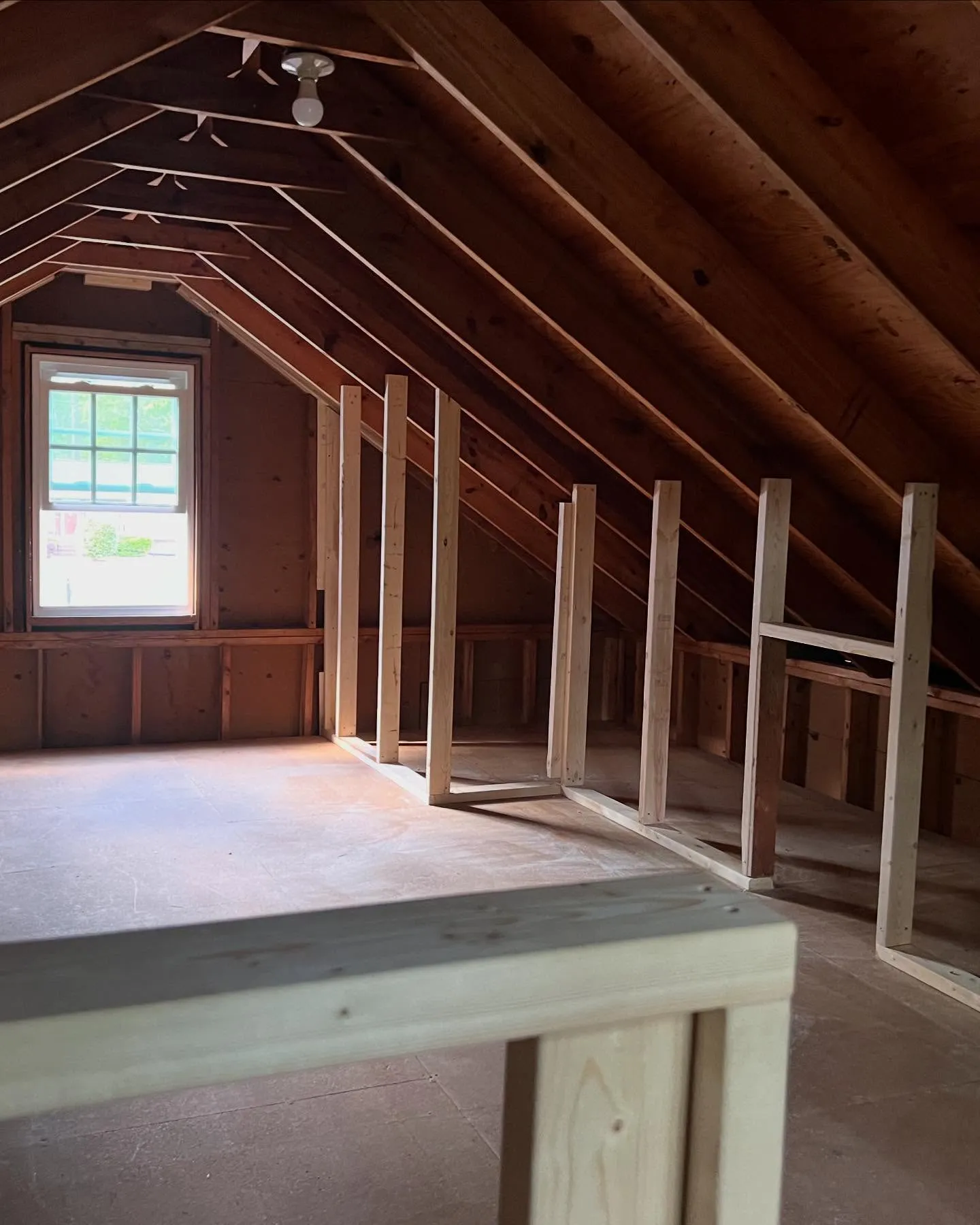 Framed attic space built during a new home construction by Lee Brothers Construction in Greenville, NC.