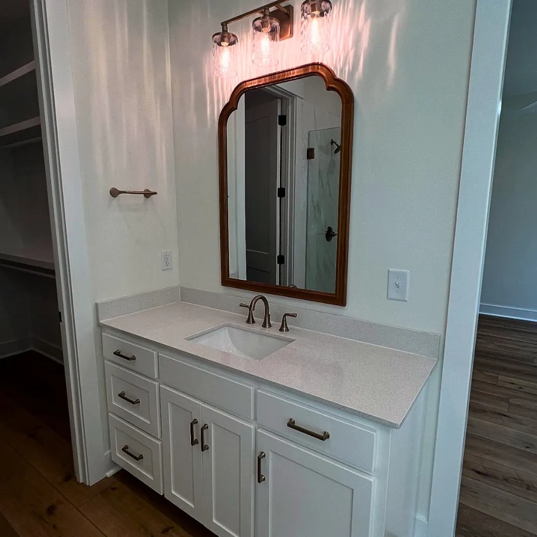 A bathroom sink and mirror constructed