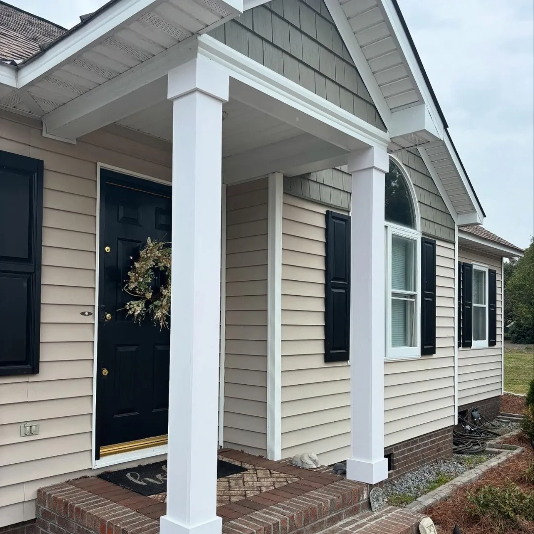 A remodel of a front porch that Lee Brothers Construction has done with new posts, new front door colors, and an overall refresh of the exterior