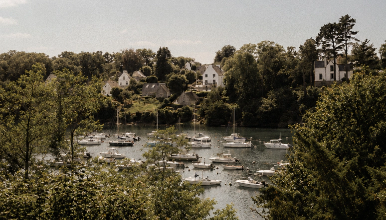 Panoramic view from the terrace of Maison Roz overlooking the Aven River in Finistère. A selection of vacation homes in Brittany available for rent year-round through The Host.