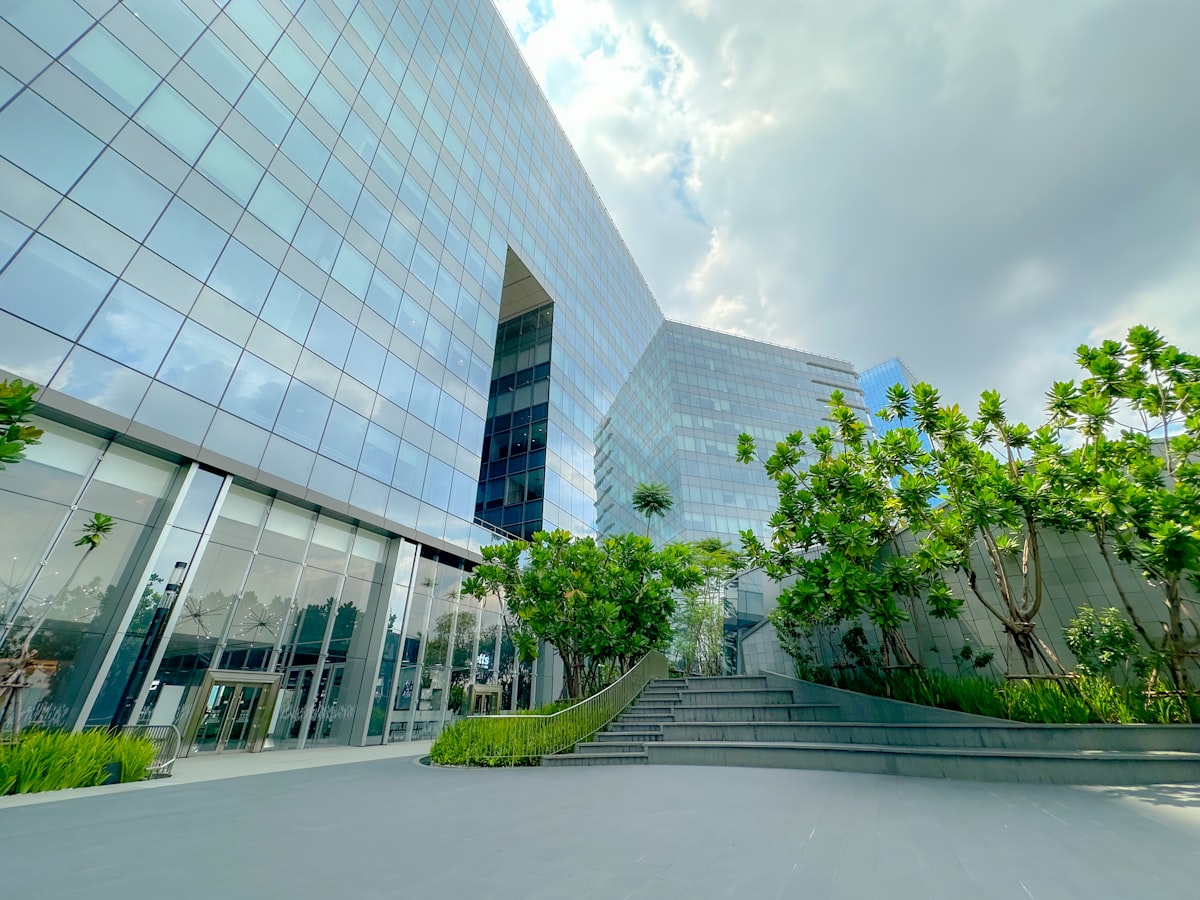 Modern glass office building with professionally maintained commercial landscape grounds in Northern Virginia