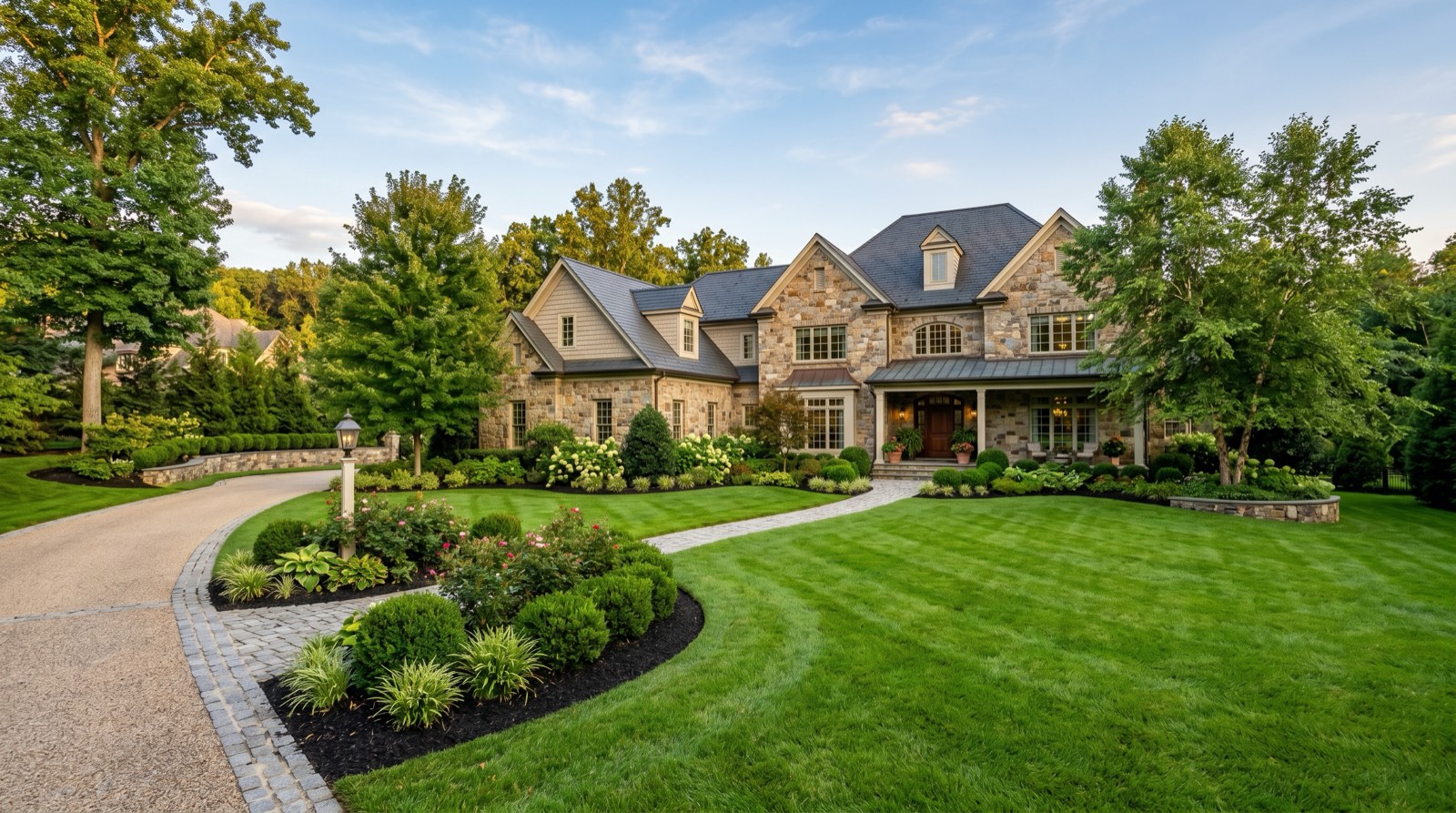 Professionally maintained residential landscape in McLean, Northern Virginia with lush lawn and planting beds