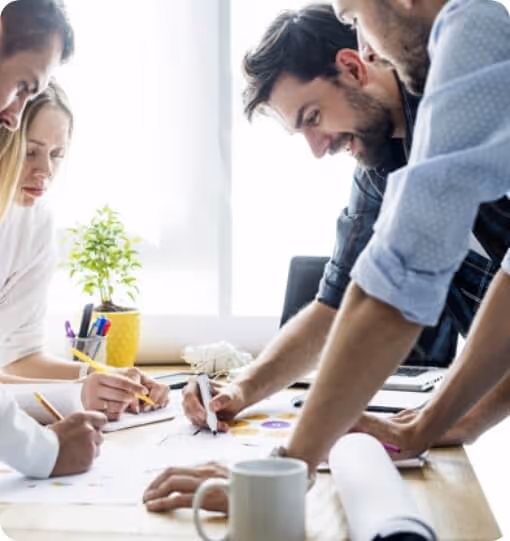 Four people collaborating at a table.