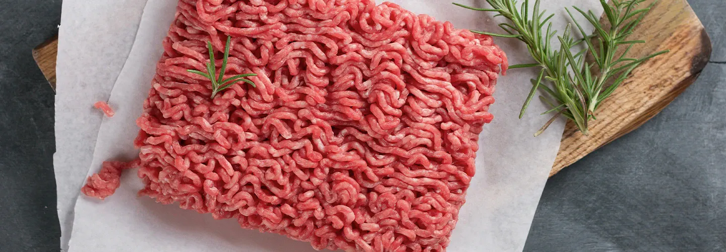 Milled meat formed into a block, typically sold in grocery stores, showcasing presence of Dohmeyer in food / meat processing industry.