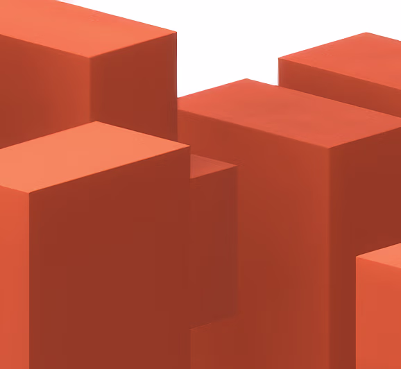 Close-up of several orange rectangular 3D blocks arranged at different heights on a white background.