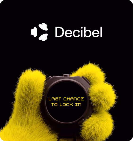 Yellow furry hand holding a black circular device displaying the text 'LAST CHANCE TO LOCK IN' under the Decibel logo on a black background.