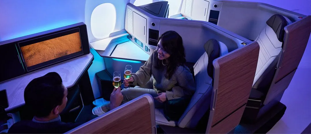A couple of people that are sitting in a plane.