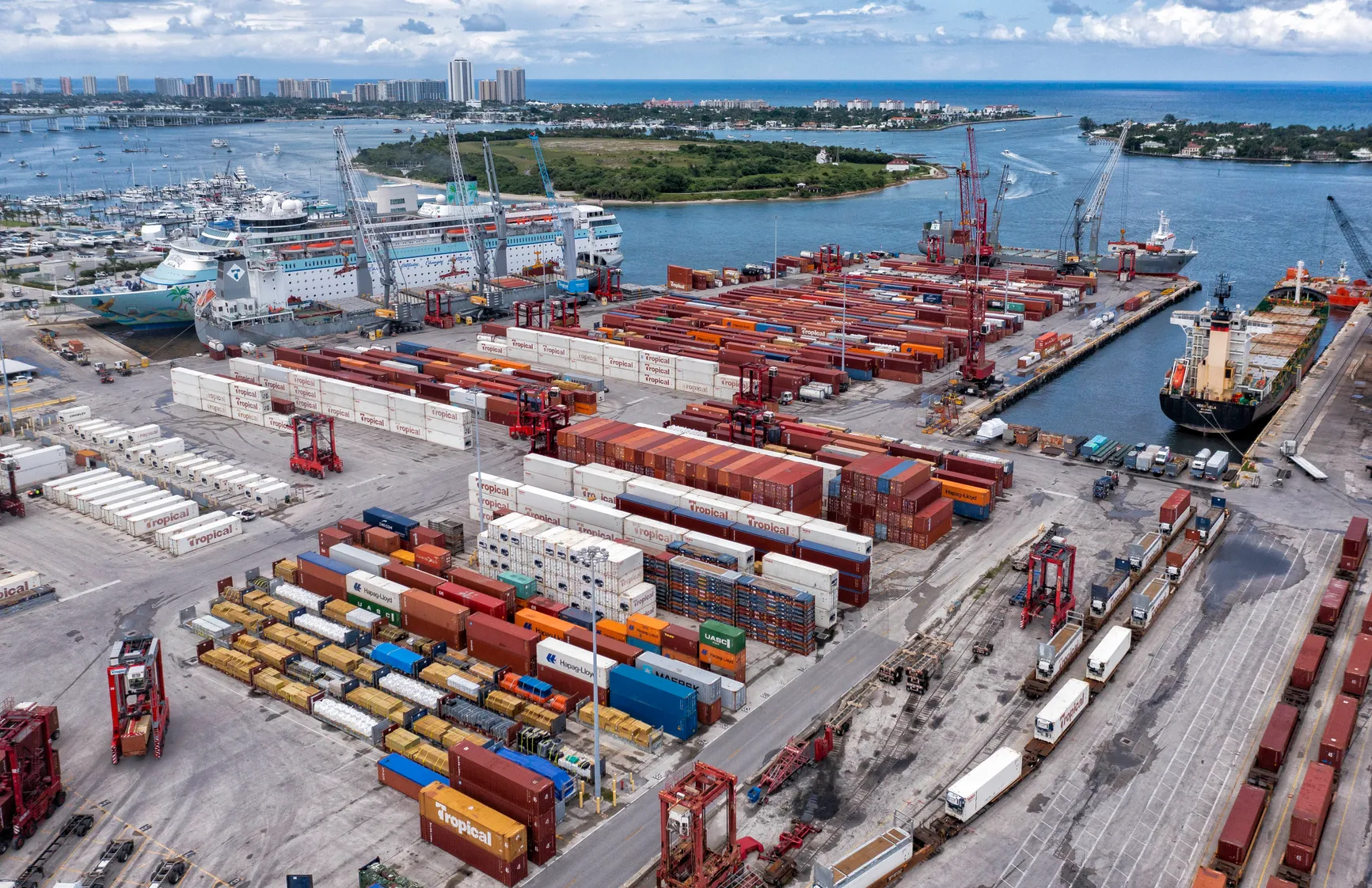Aerial view of the Port of Palm Beach terminal with cargo, cranes and vessels