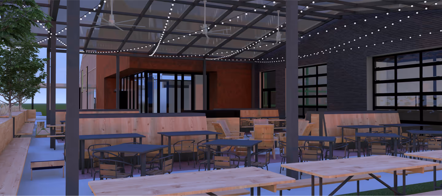 Outdoor covered patio with wooden tables, chairs, string lights, and planters along the side.