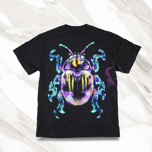 a black concert shirt with a colorful bug on it