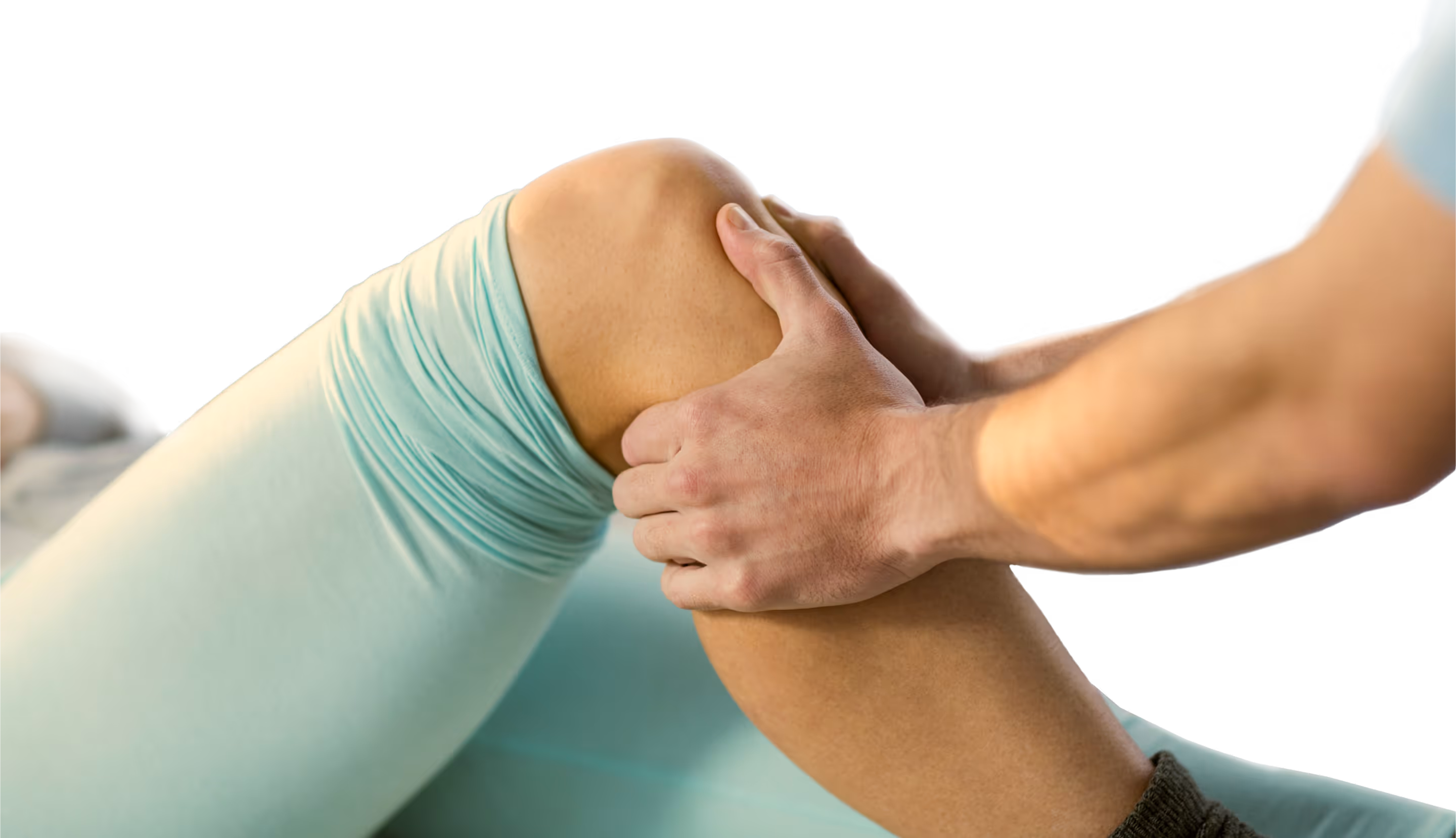 Hand examining knee during medical assessment or physical therapy