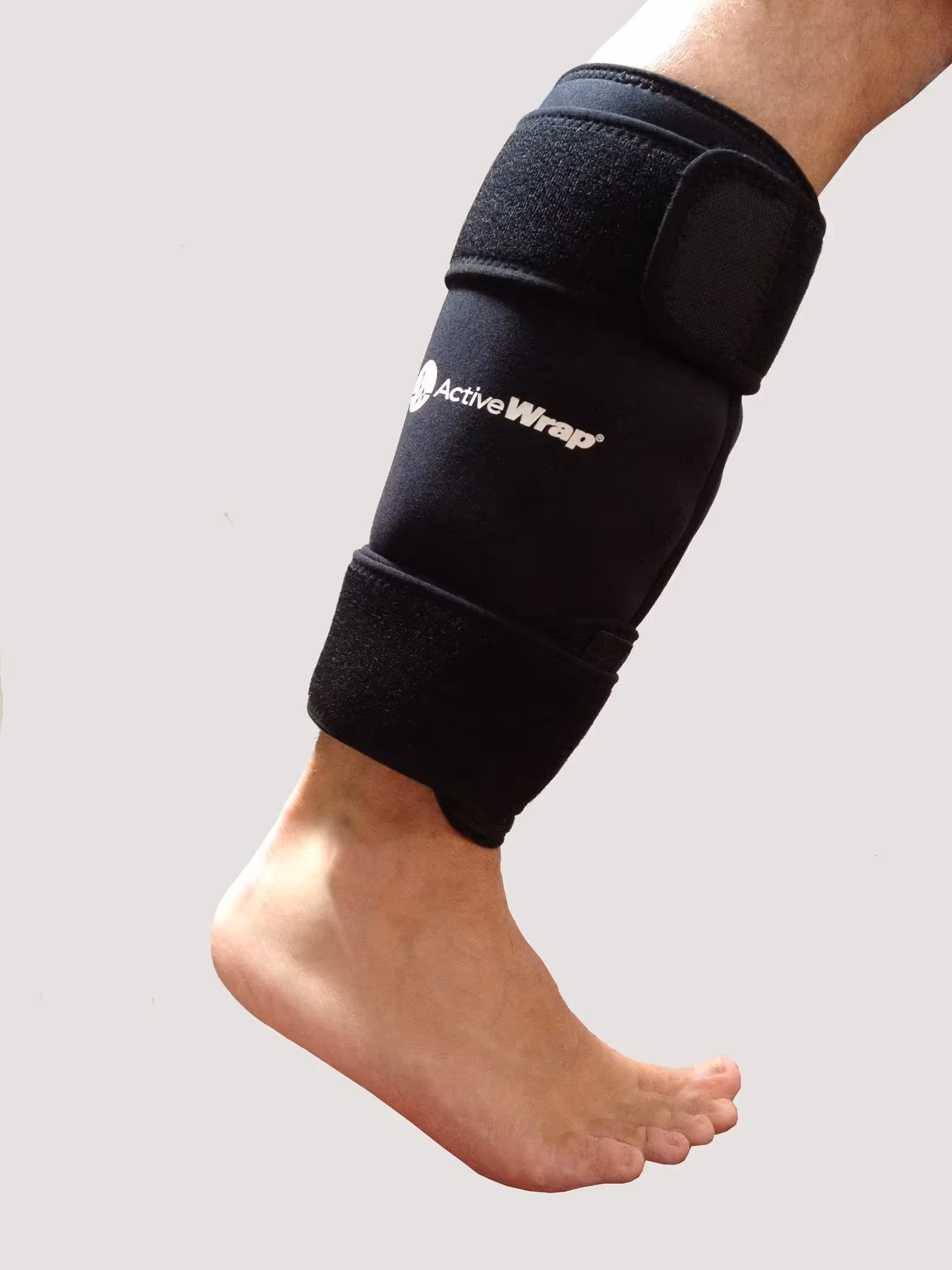 Black Active Wrap compression support on lower leg and ankle