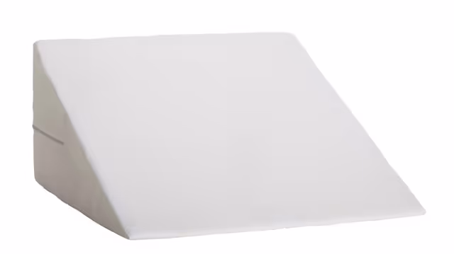 White wedge-shaped foam cushion or positioning pillow