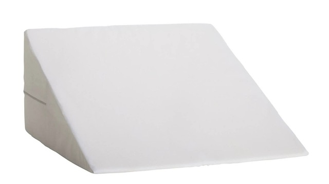 White wedge-shaped foam cushion or positioning pillow