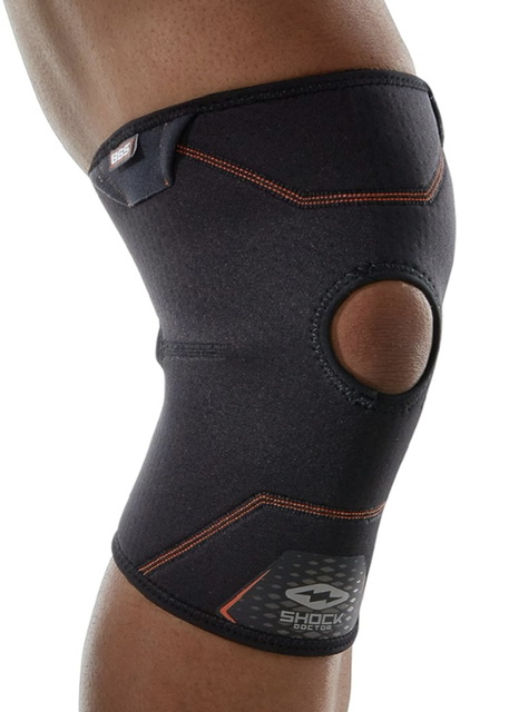 Black knee brace with orange stitching for joint support and stability