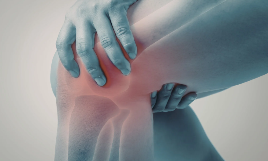 Person holding side of knee