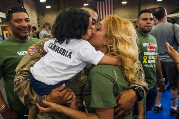 A National Guard soldier reunites with family at a homecoming