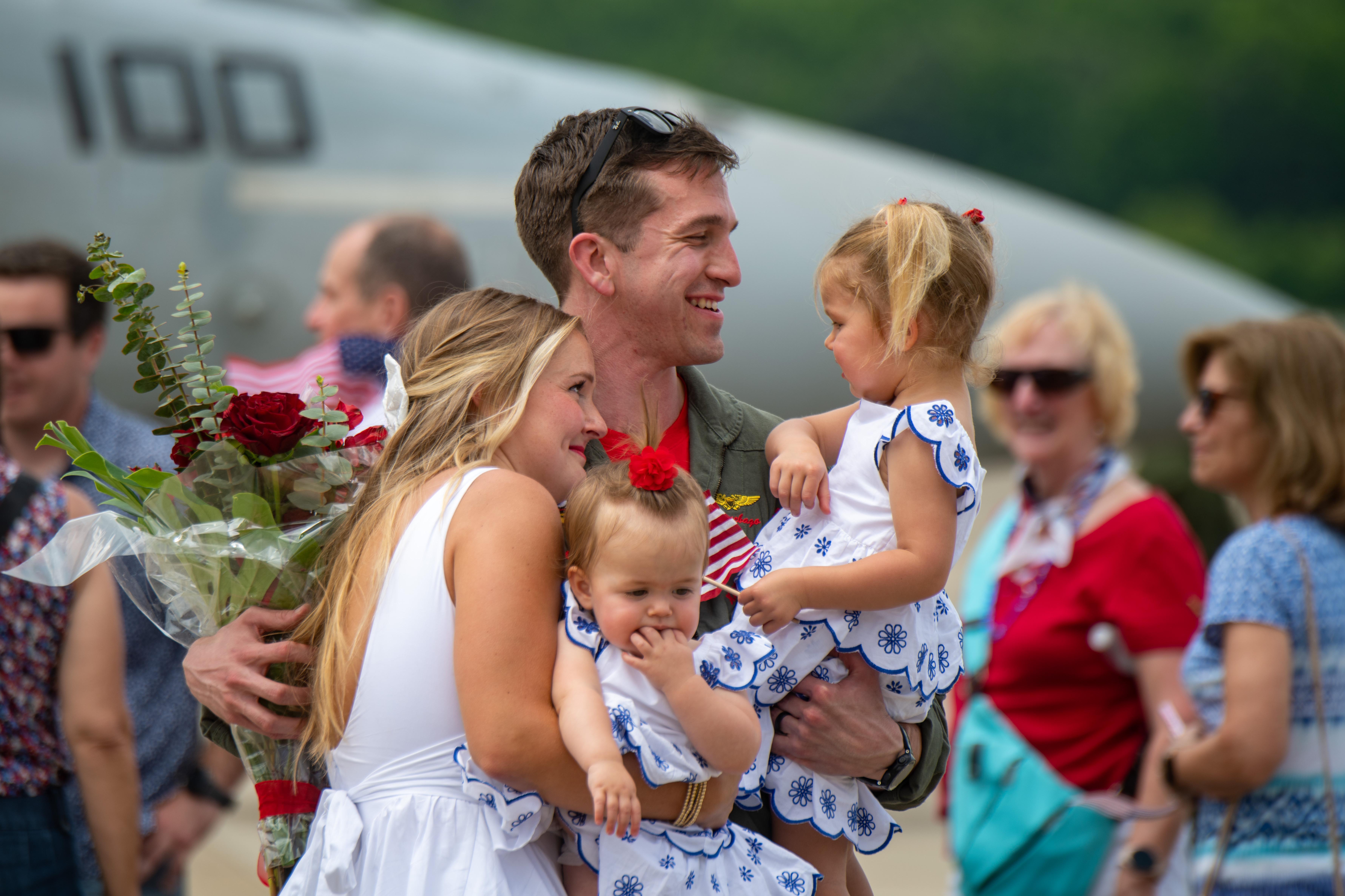 A National Guard soldier reunites with family at a homecoming
