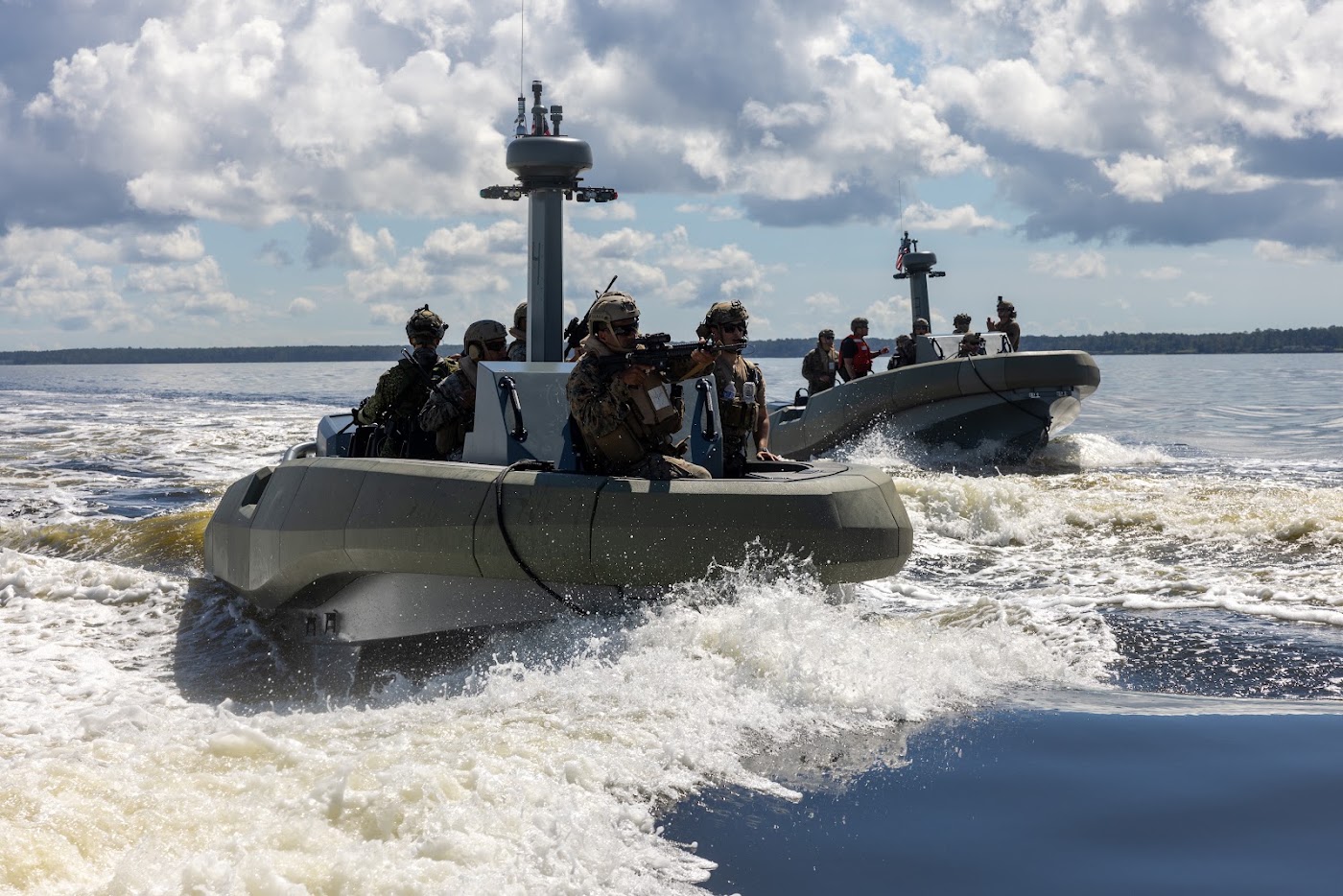 Small boat team running at speed across open water