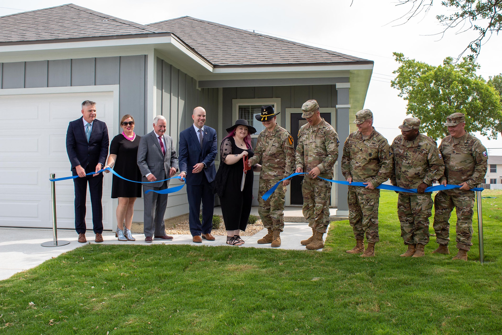 A military family receives the keys to their new home at Fort Cavazos, Texas