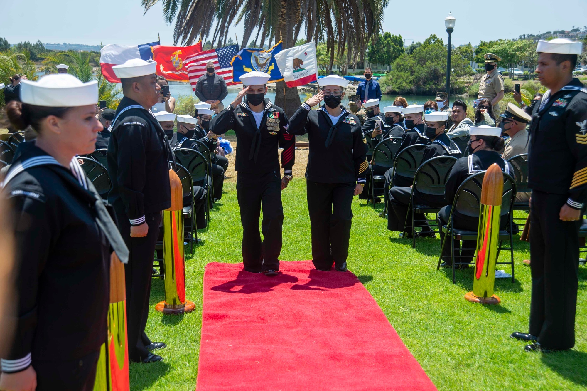 A retiring service member and spouse honored together at a military retirement ceremony