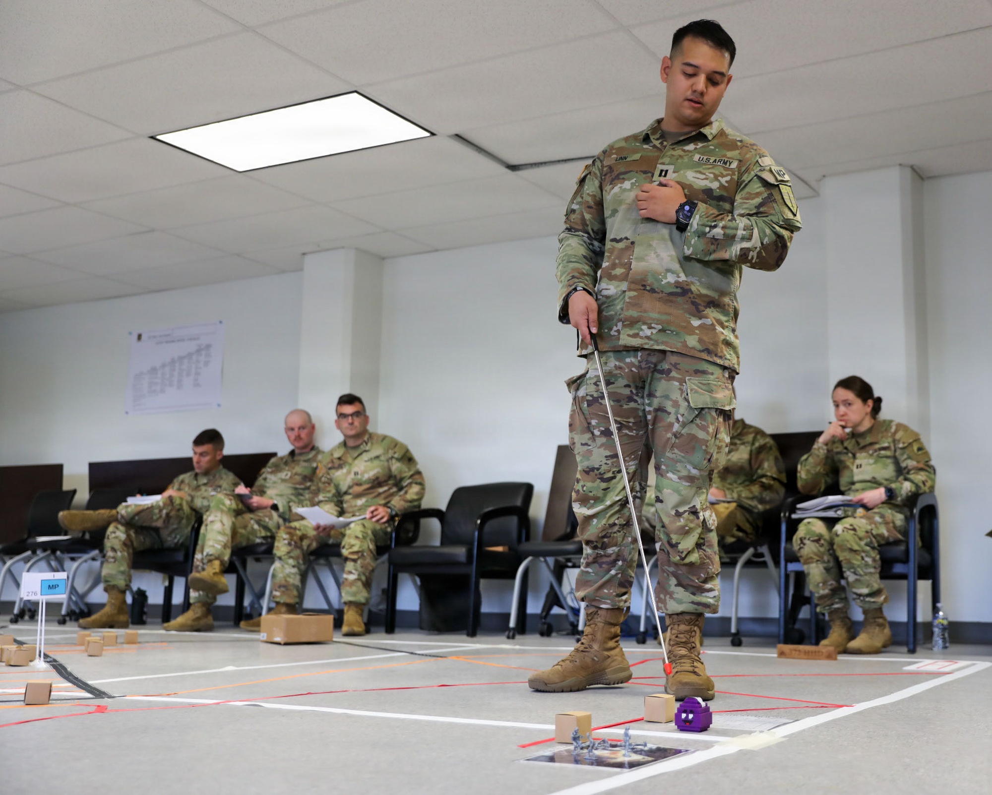 A National Guard officer briefs members during a drill at the armory