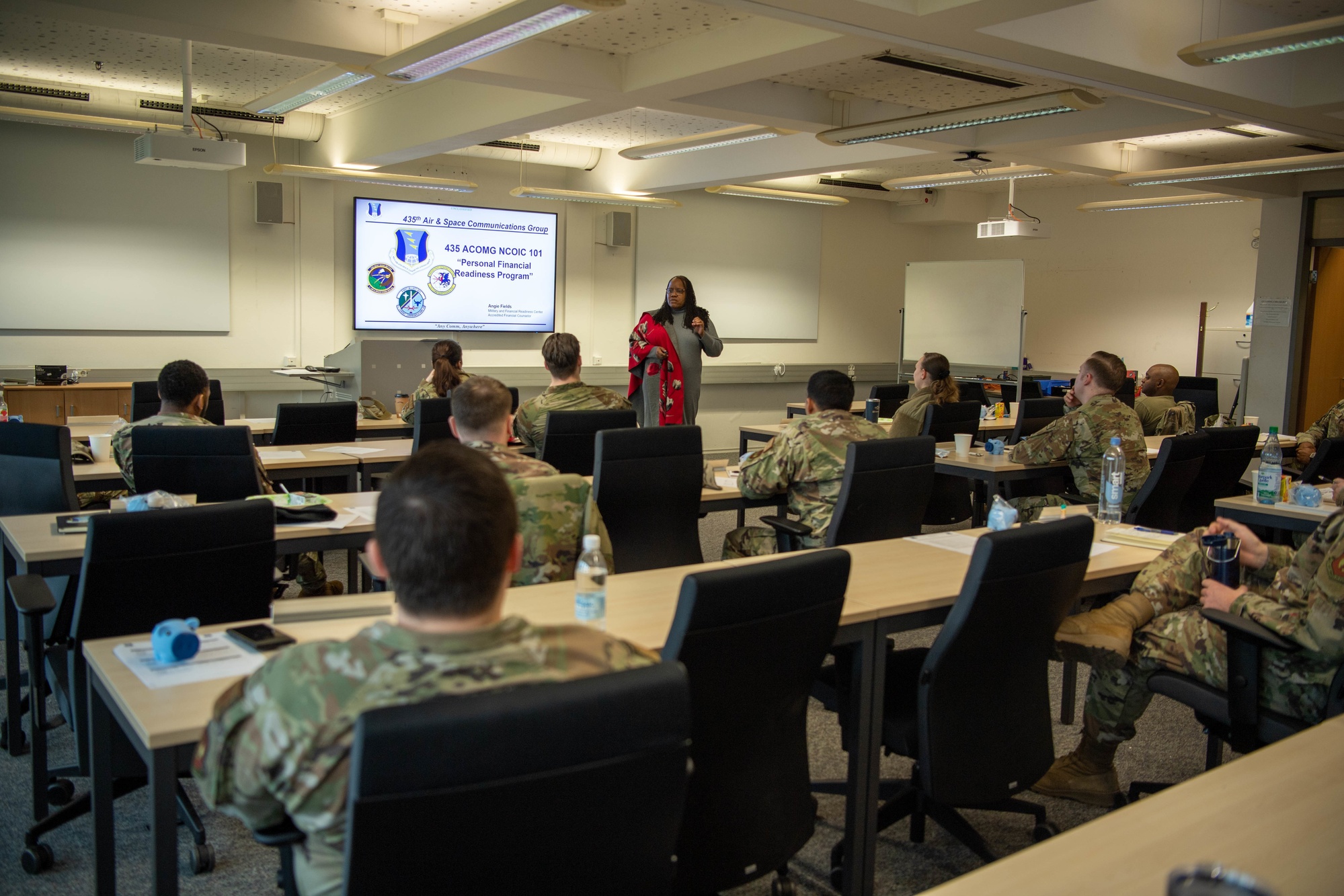 A personal financial manager leads a financial readiness class for military community members
