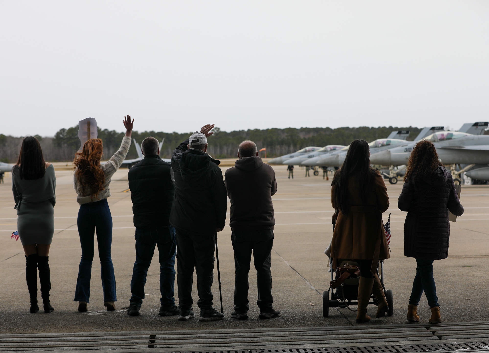Families wait on the flightline for a squadron homecoming