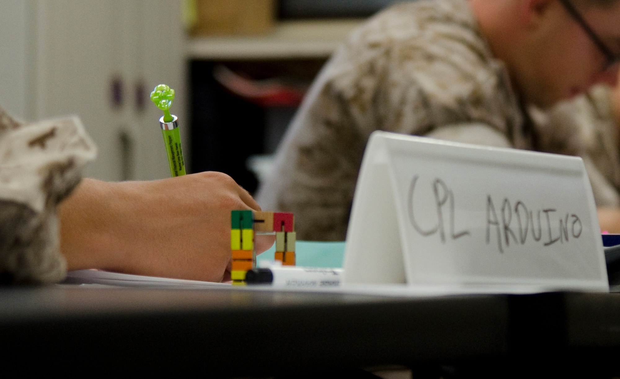 A budgeting worksheet and statements on a table during a financial readiness class