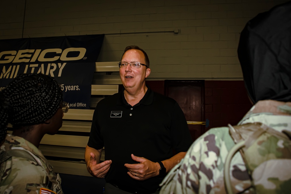 A Personal Financial Counselor talks with Soldiers about managing money during a financial readiness