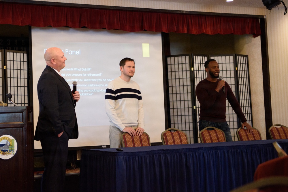 Service members and families attend a financial planning session during a Military Retirement Sympos