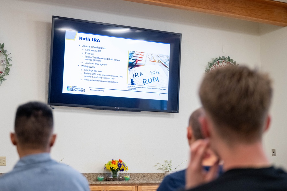 Airmen attend a personal finance briefing at McConnell Air Force Base, Kansas.