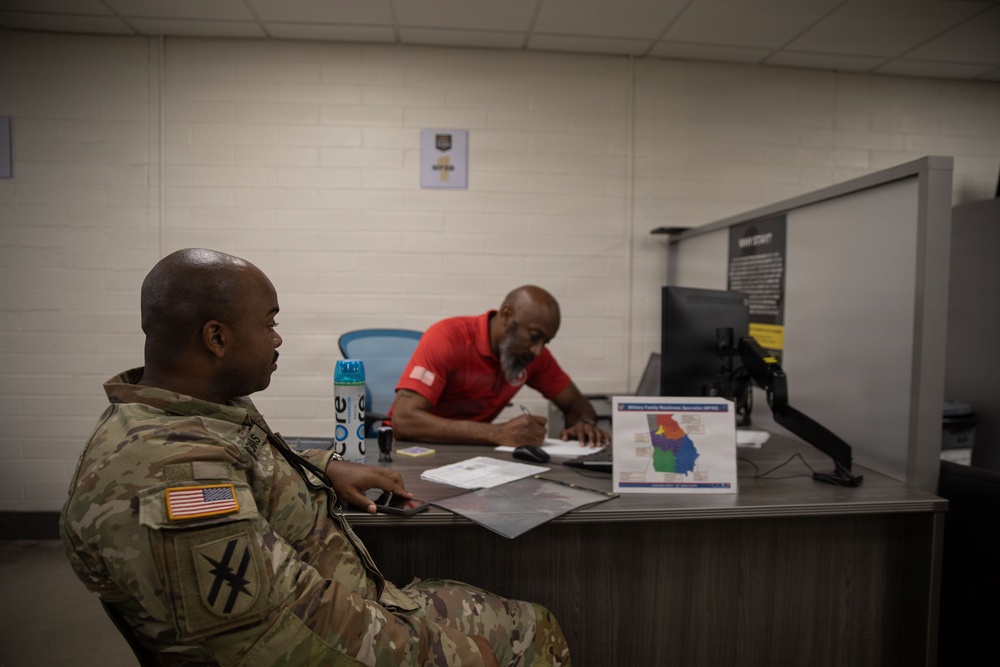 Georgia Army National Guard Soldiers receive a briefing on Guard benefits during a Soldier Readiness Processing event.