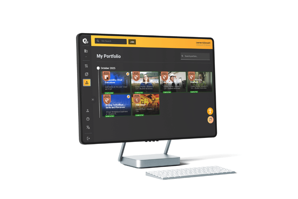 Desktop monitor displaying the Edge Factor Badges & Portfolio with various completed courses and badges, accompanied by a white keyboard.