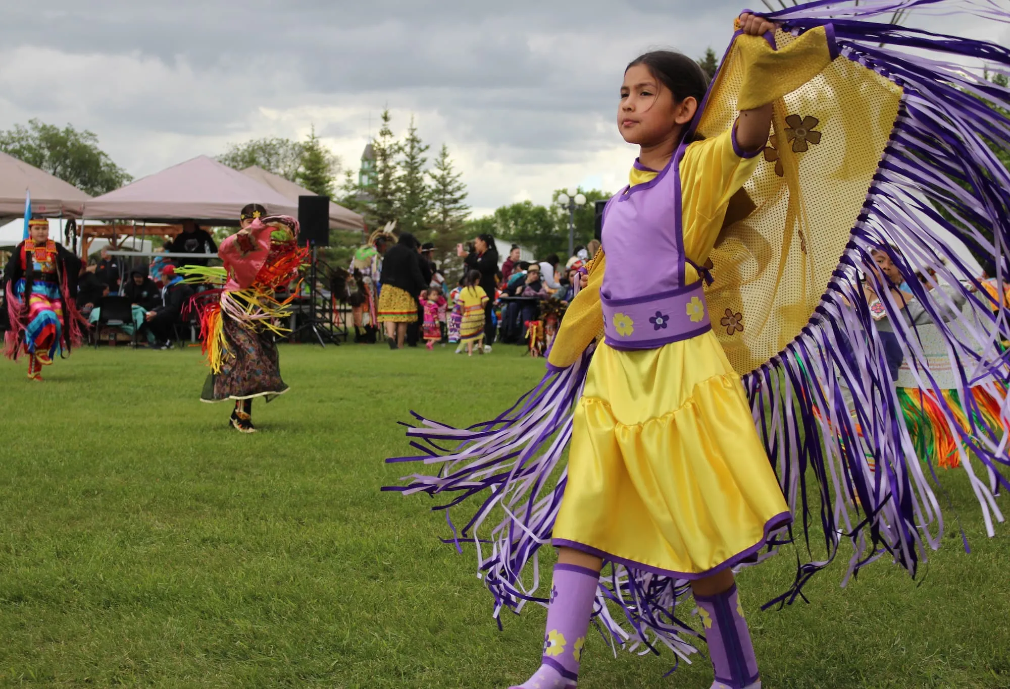indigenous children dancing at community gathering